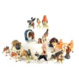 A group of ceramic ornaments and figures to include Goebel birds, West German made boxer dog,