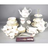 A Royal Albert "Lavender Rose" pattern tea/ dinner service comprising cups, saucers, teapot, plates,