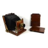 An antique James Wooley, Sons and Co Ltd studio camera, fitted with a James Wooley "The Victoria"