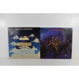 Two autographed Moody Blues LP records, both signed by Justin Hayward.