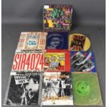 A group of punk rock vintage vinyl 45 singles, including Sex Pistols, God Save the Queen, picture