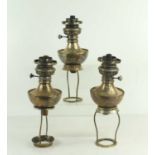 A group of three silver plated Benson candlestick oil lamp convertors, all Regd mark 123692.