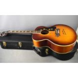A Gibson style acoustic guitar with hardcase, the main body of the guitar has been signed by Chas