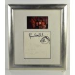 A framed autographed card signed by Paul McCartney and Linda McCartney, the signatures were