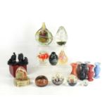 A group of glass paperweights of various styles together with agate miniature urns and other items.