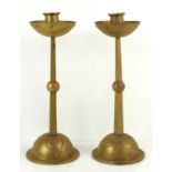 A pair of WMF Jugendstil brass candlesticks, planished with domed bases, incised petal and