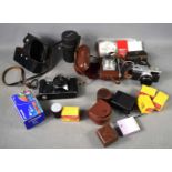 A group of vintage cameras and accessories to include a 1960s Zenith camera, Futura camera,