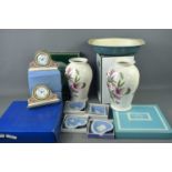 A group of ceramics to include two boxed Portmeirion Botanic Gardens vases, boxed Wedgwood clocks,