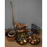 A large selection of copper and metalware, to include fireside items, kettle, cook book stand, horn,