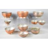A group of ten Iranian/Middle Eastern copper and silvered copper bowls, of varying sizes, smallest