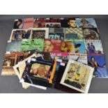 A collection of vintage vinyl singles, mostly 1980's including Adam and the Ants, Antmusic, 9352,