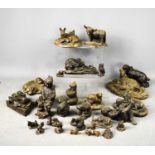 A group of resin bronze style sculptures, in the form of various animals such as spaniel,