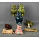 A Wade Natwest piggy bank, Holkham pottery house form money box, three owl examples, a Sylvac dog