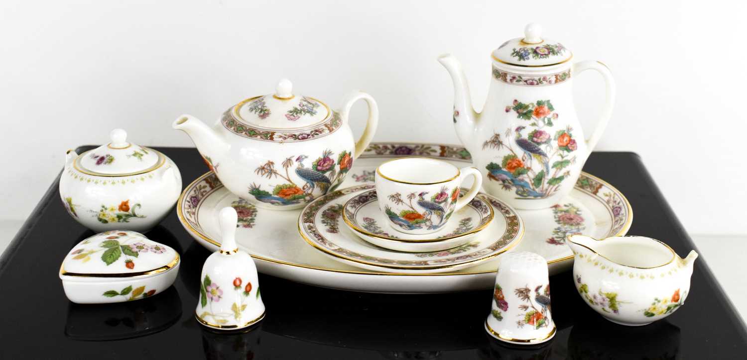 A miniature Wedgwood tea set comprising tea tray, teapot, hot water pot, and cup saucer and tea