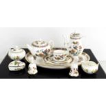 A miniature Wedgwood tea set comprising tea tray, teapot, hot water pot, and cup saucer and tea