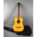 A vintage Tanglewood TW60 acoustic guitar with bag.The guitar has no splits or cracks, but a few