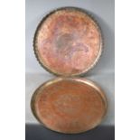Two large Iranian/Middle Eastern copper trays, each of circular form, the larger with fluted and