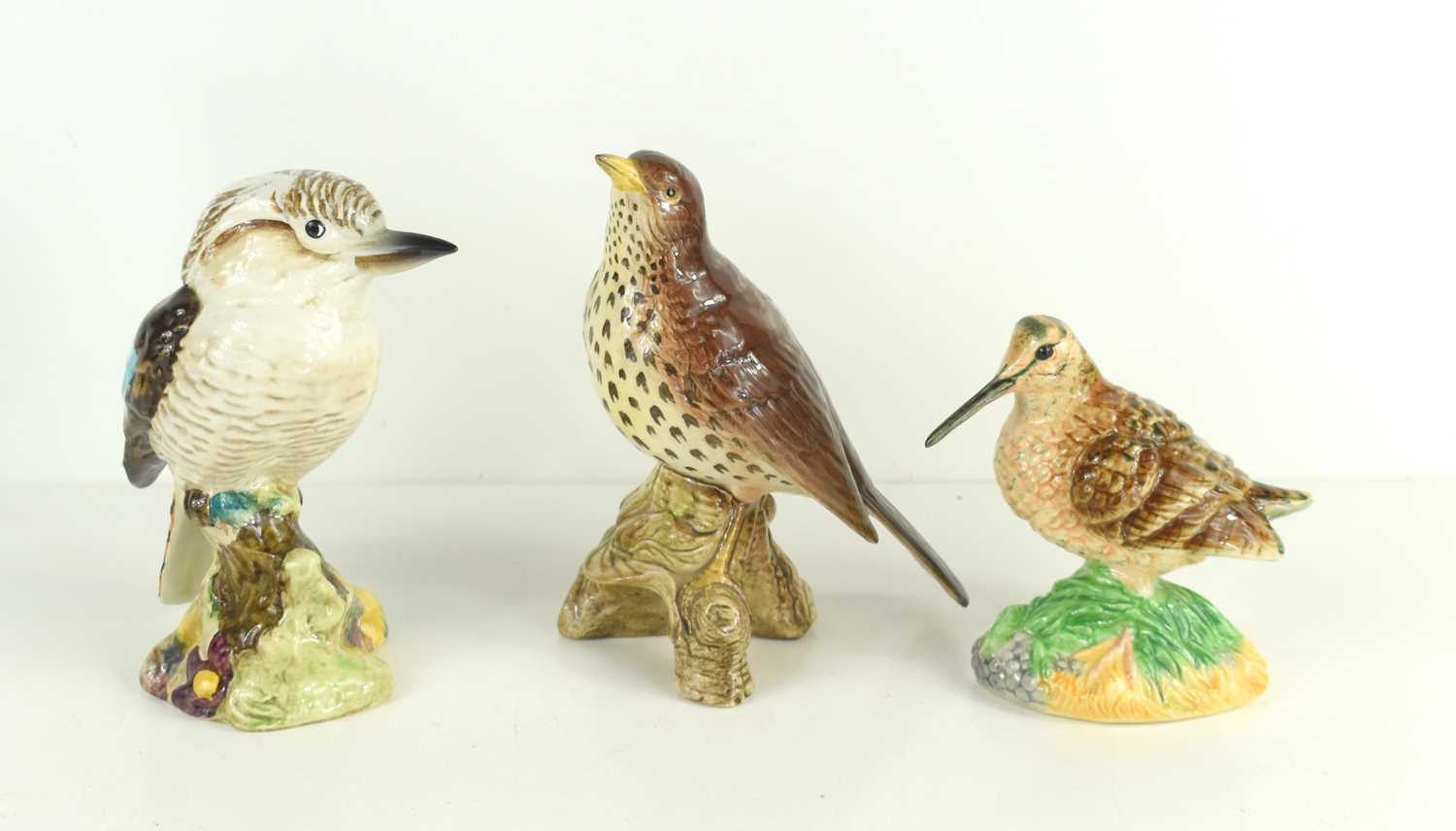 A group of Beswick birds comprising of a Kookaburra 1159, Songthrush 2308, a Sandpiper, a Magpie