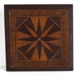 A 19th century parquetry inlaid cribbage board, the centre having starburst decoration, box