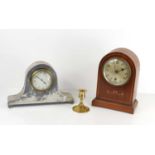 An Arts and Crafts pewter mantle clock, of tambour form, with leaf decoration and planished
