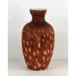 A vintage red and cream swirl Murano type glass vase with dimpled shoulders, 23cm high.There is a