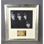 The Beatles Autographs: A framed picture of the Beatles with signed paper underneath bearing the