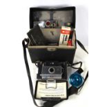 A vintage Polaroid Automatic 100 Land Camera in its original fitted case with accessories to include