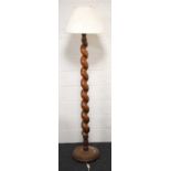 A Victorian mahogany standard lamp, in a bold, graduated barley twist form, 173cm high.