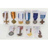 A group of medals to include the Croix De Guerre with palm spray, Order of Polonia Restitua 1944,