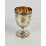 A fine silver chalice, London 1864, by Hunt & Roskill, with gilded interior, and engraved with