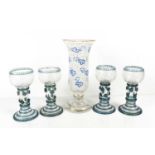 A set of four engraved, coloured and clear glass hock glasses, likely Austrian or Bohemian, the