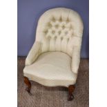 A Victorian button-back nursing chair, upholstered in eau-de-nil, Art Deco style, fan fabric.