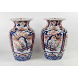 A pair of 19th century Imari vases, 26cm high.