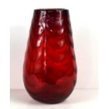 A Whitefriars ruby red glass vase with waved ribbed pattern, 30cm high.