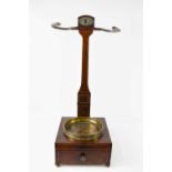 A George III mahogany and satinwood lined Church Pipe stand with a brass tray, snake form arms and