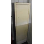 A cream painted metal gun cabinet with keys, 39 by 25.5 by 130cm high.