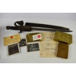 A WWI bayonet, having belonged to Frederick William Ellis, his name inscribed to the leather