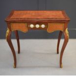 A late 19th / early 20th century mahogany and parquetry serpentine games table, with folding top,