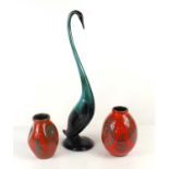 A pair of red Italian vases together with a blue Canada goose.