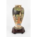 A 20th century decorative Satsuma Japanese vase, decorated with figures of baluster form, with