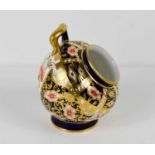 A Royal Crown Derby miniature Imari pattern salt pot.