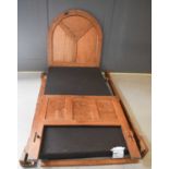 A Robert Mouseman Thompson early 1930s single bed, the three panel headboard carved with roundels,