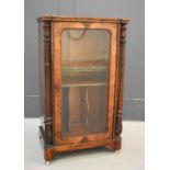 A Victorian inlaid burr walnut music cabinet, circa 1870, the quarter veneered top with inlaid