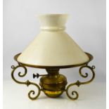 A brass paraffin lantern with opaque glass shade, three s-scroll arms, lacking hanging chain, 43cm