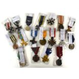 A group of WWI and later German medals to include West Wall medal with paper packet, WWI Iron Cross,