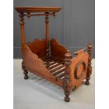 A 19th century mahogany dolls half tester bed, with ornate carved turned columns, and canopy, 94