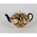 A Royal Crown Derby miniature Imari pattern, teapot and cover, 1940s.