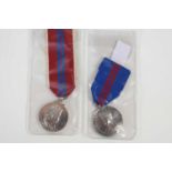 A King George V Coronation medal 1911 together with an Elizabeth II coronation medal 1953.