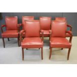 A set of six 20th century teak boardroom chairs, each upholstered in red leather backs and seats.