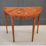 A 19th century satinwood painted demi-lune card table, the top decorated with painted putti,